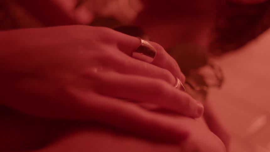 A couple hold each other in the bathroom