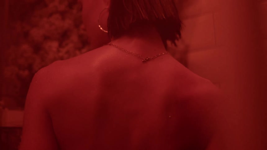 A woman is standing in the bathroom