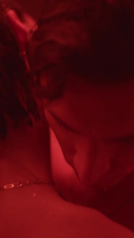 A man puts his arms around a woman and rests his head on her shoulder