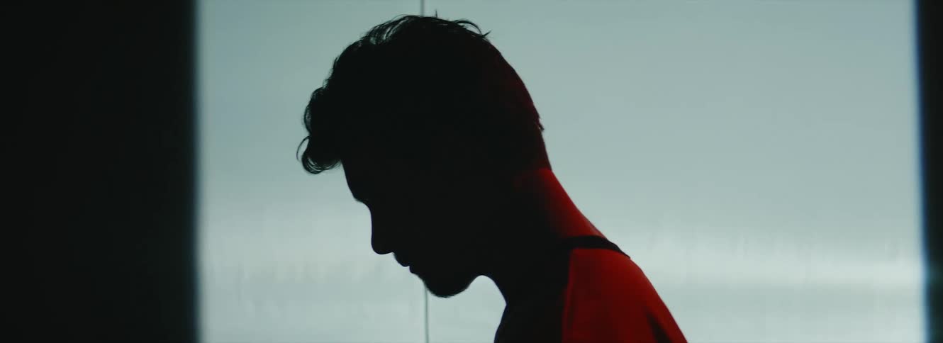 A man walks in the dark room