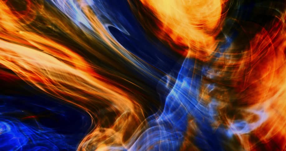 Computer graphics special effects of yellow and blue waves floating and moving against a black background