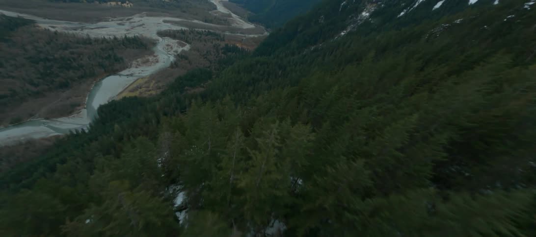 A river runs through a canyon in the mountains