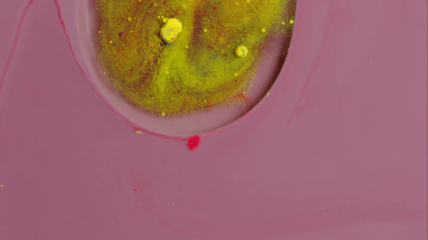 A yellow orb of mixed substance and yellow dots are moving in a pink environment with a red streak