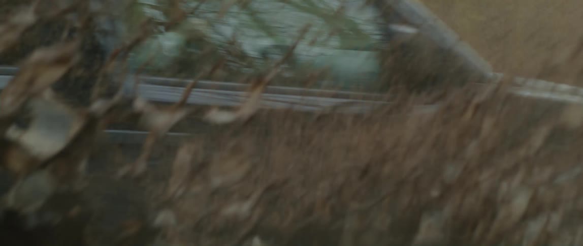Black four wheel drive drives on muddy dirty road in the forest