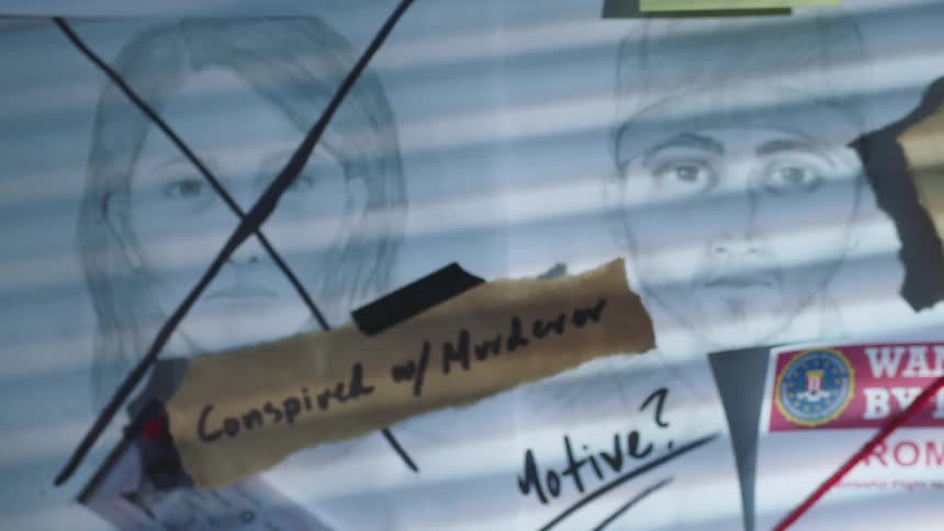 Suspect sketches on a board with wanted posters