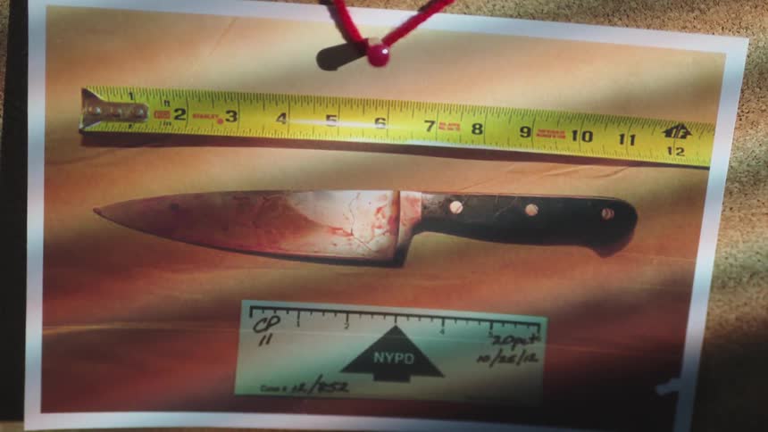 Coroner reports and a photograph of a bloody knife tacked on a bulletin board