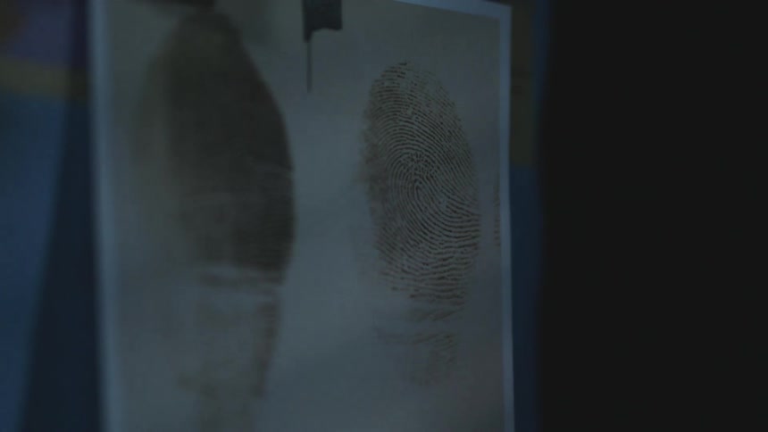 Close up of fingerprints on detective board