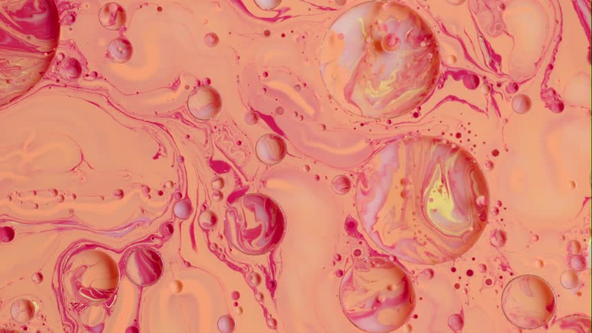 Circles and bubbles floating and swirling on the surface of paint