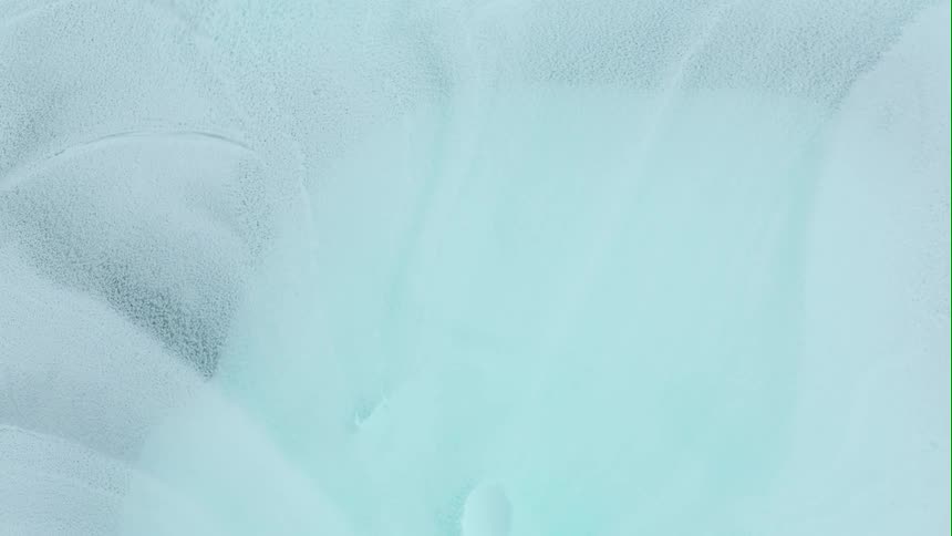 A bright white powder spreads outward