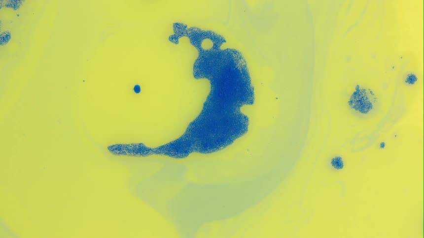 Blue circle scatters on yellow water