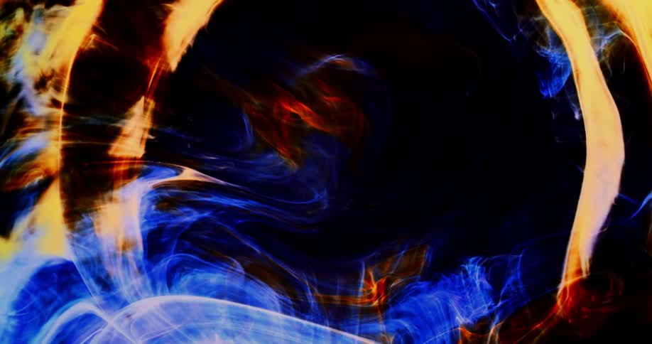 Smoky lights move and explode into circles through the darkness