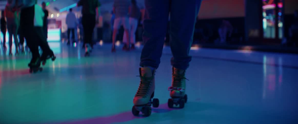 People roller skating at a roller rink