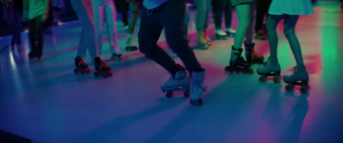 People are having fun skating in the roller rink
