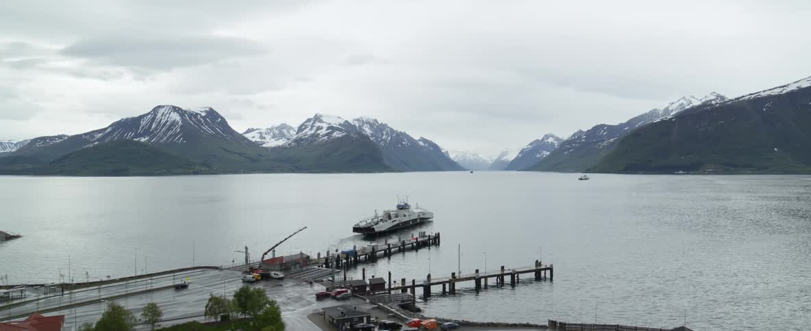 Aerial view of a ferry leaving port in Norwegian fjords