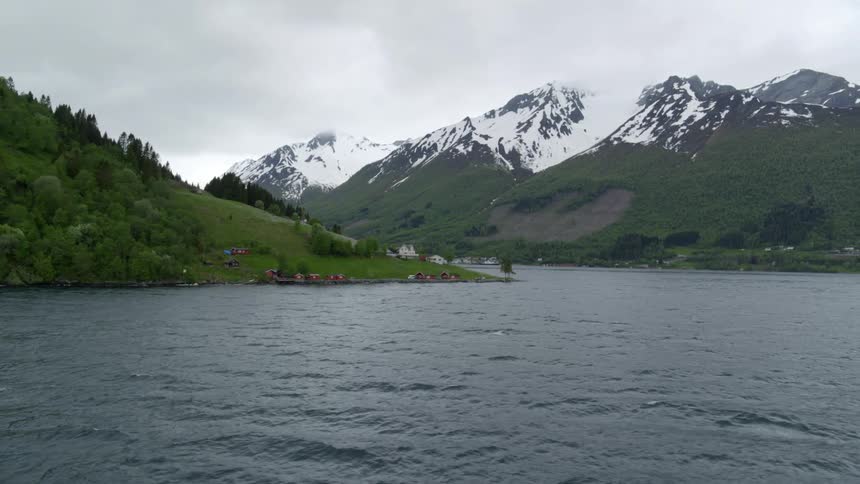 A view of snowy mountains in a Norwegian fjord