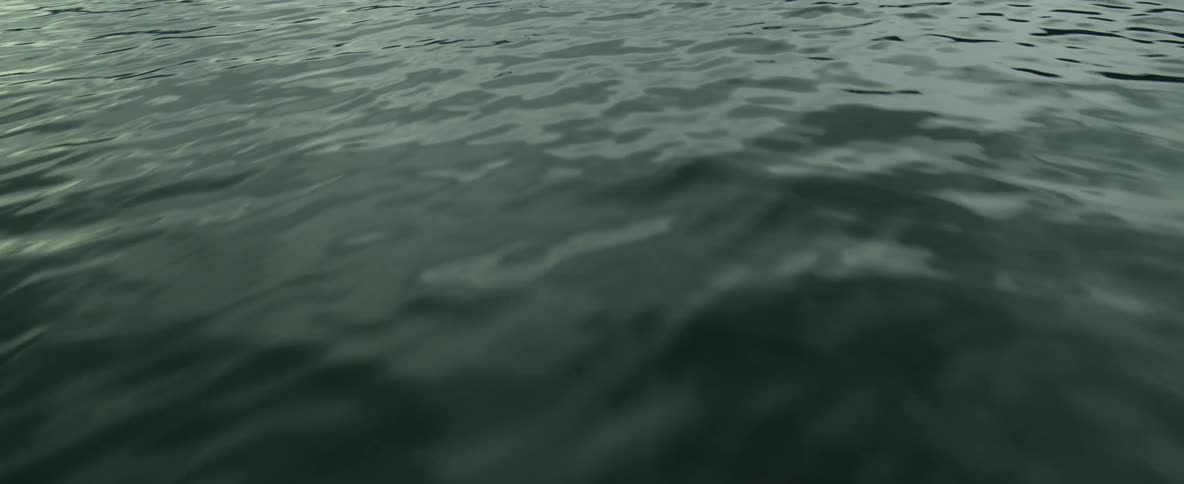 Drone shot of Norwegian fjord flying over water