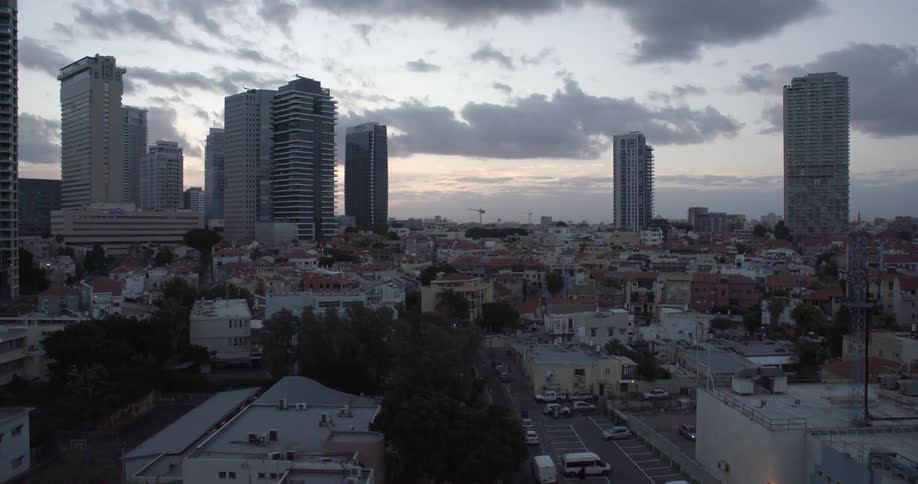 A large city with high rises under a dawn sky