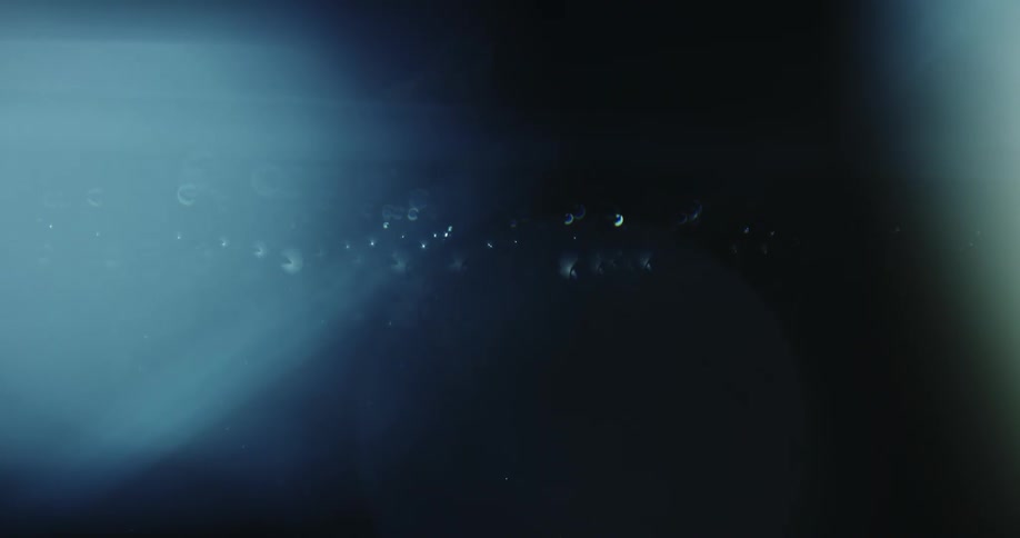 Water drops fall then the liquid moves in waves