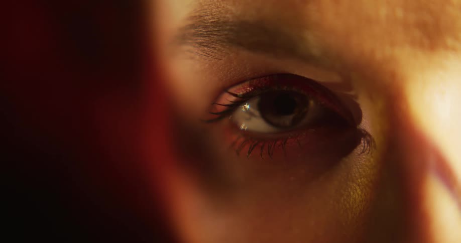 Close up view of a womans face is displayed