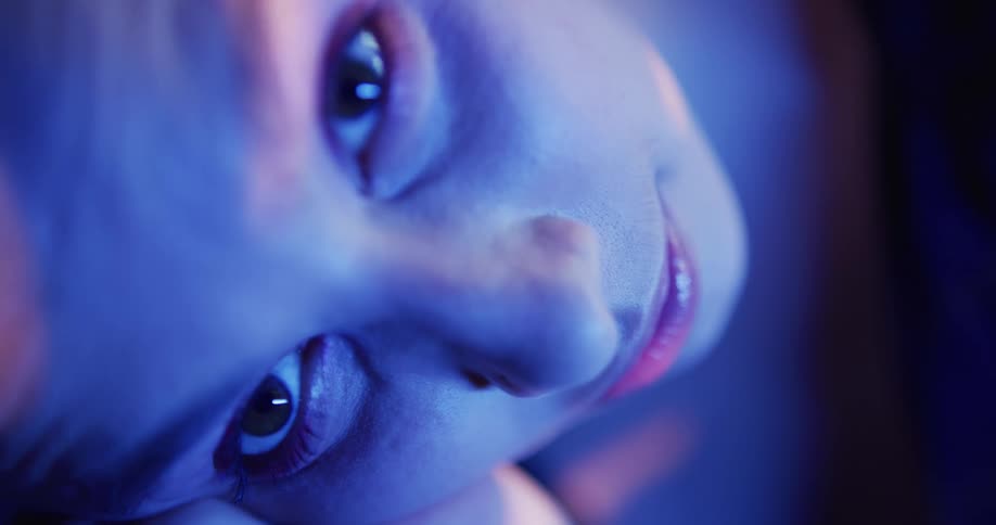 Close up view of a womans face is displayed