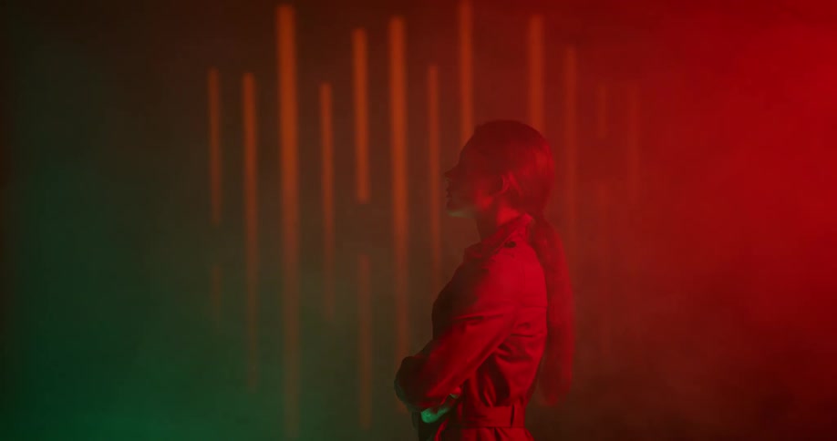 A woman is standing in a room with smoke