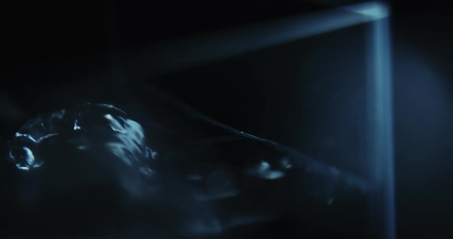 In a dark and eerie environment a liquid can be seen bubbling up