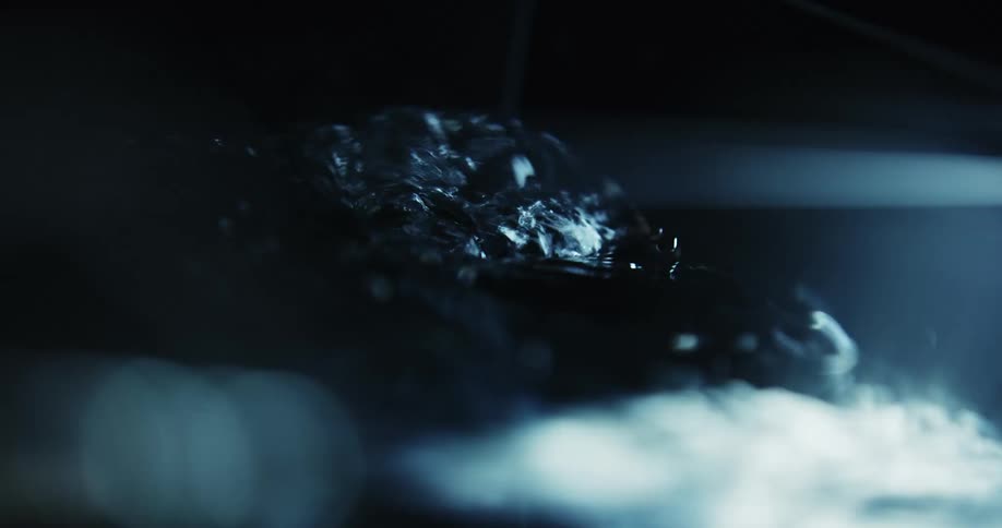 Crystal clear water ripples in a container
