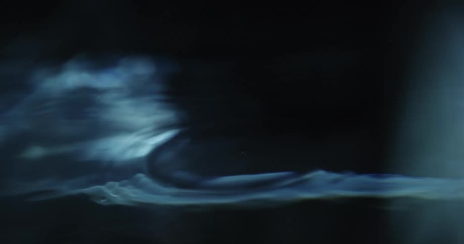 Sunlight reflects on the water as bubbles rise to the surface