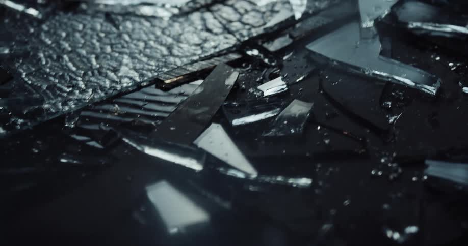 Close up of broken shards of glass in the crime scene