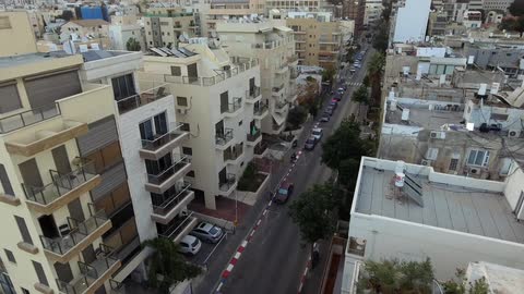 A car lined street in a city
