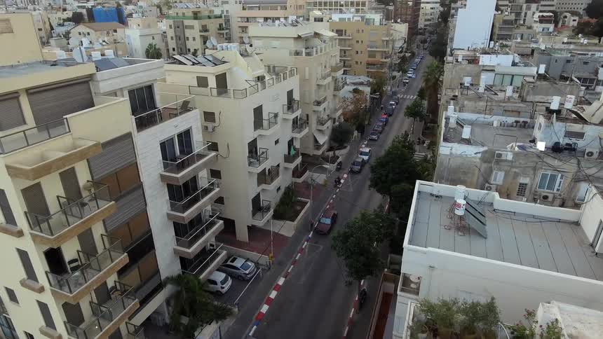 A car lined street in a city