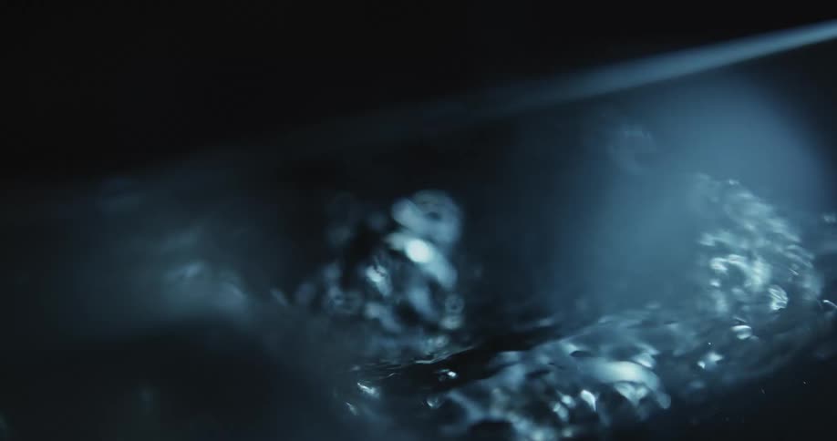 Bubbles are coming to the surface as water is boiling