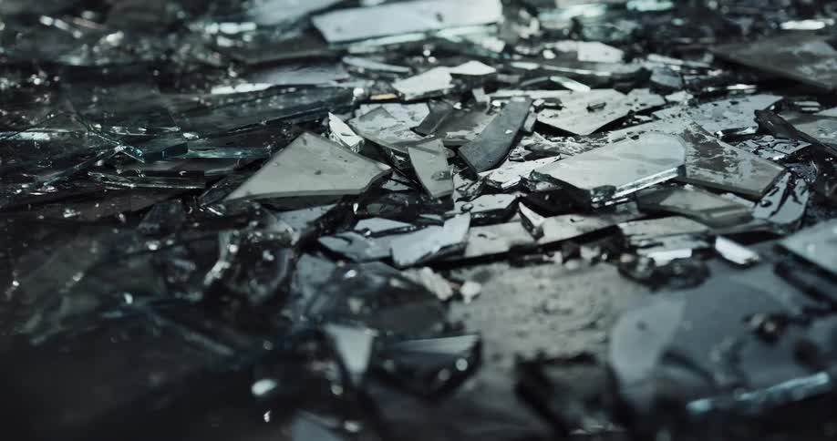Street is littered with fragments of broken glass at crime scene