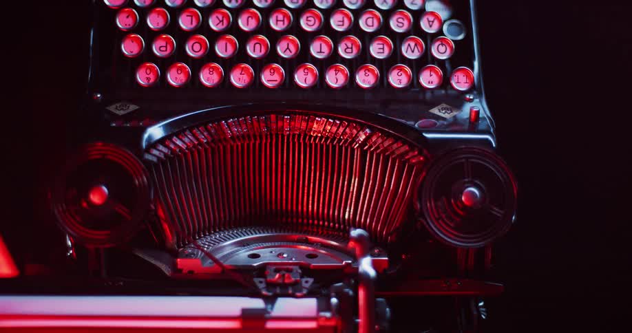 Light shines on the keys and type bars of an old typewriter
