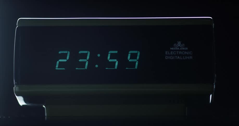 The numbers on a digital clock change from 2359 to 000