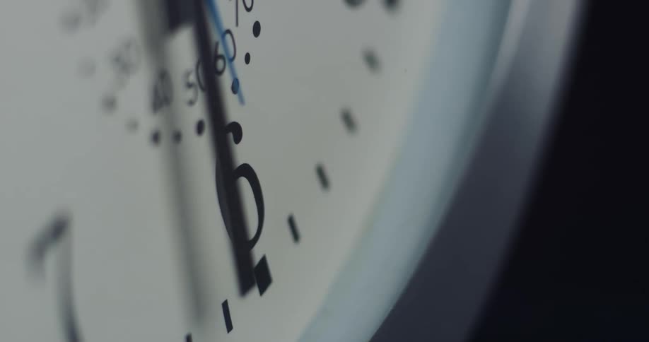 Close up of analog clock with hour hand minute hand and second hand