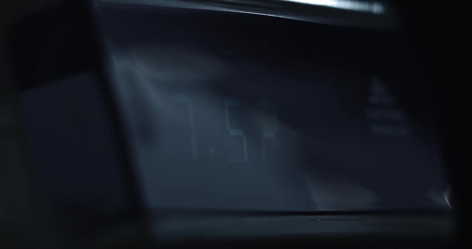 A time lapse of a digital clock is shown sped up considerably with the clock showing the time go from 100 to 400