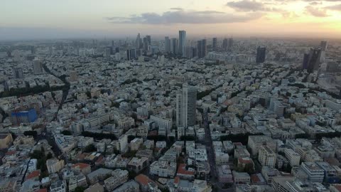 The sun is setting over this large city