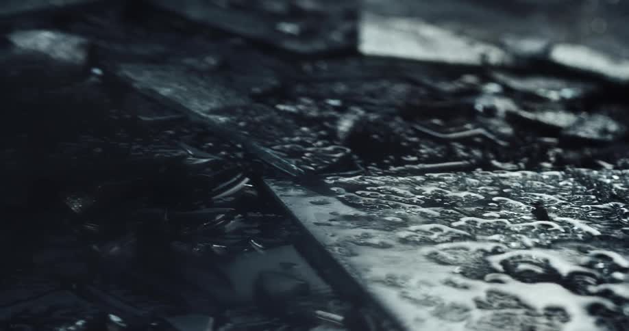 Close up of broken shards of glass while raining