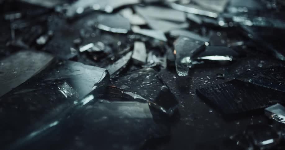 Close up of broken shards of glass at crime scene