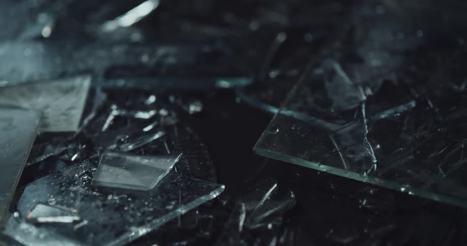 Street is littered with fragments of broken glass at crime scene