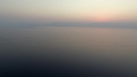 A body of water at sunrise