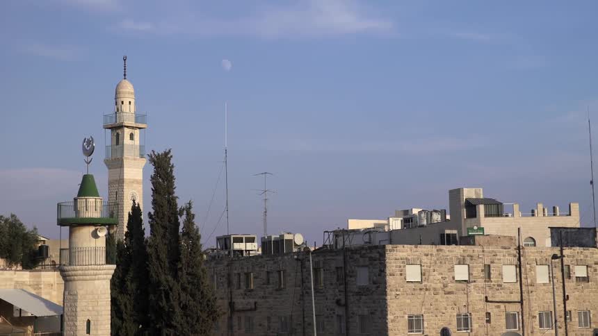City buildings are shown on a sunny day