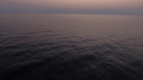 Travelling over the ocean on a cloudy evening