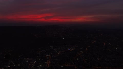 A skyline over a city is a red color