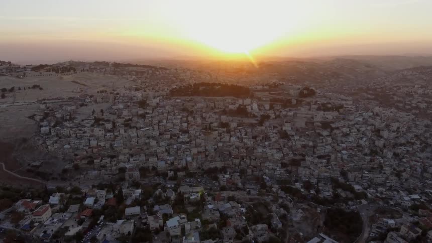 An aerial footage of rural city at the sunset