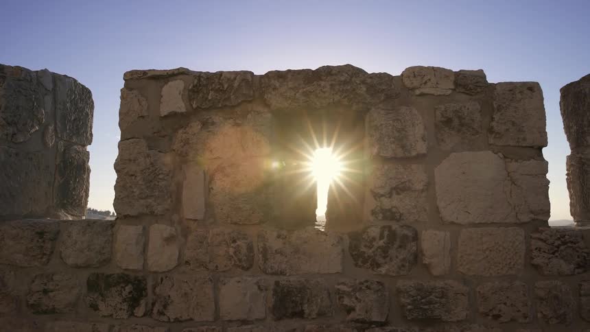 Sunlight shining through an old stone building