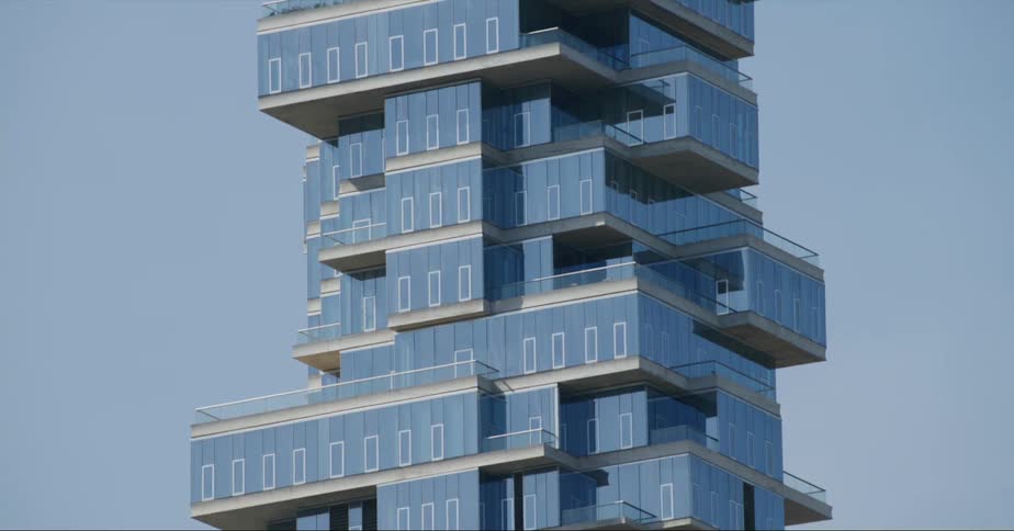 Footage of the jenga building in new york city seen from a moving vehicle at daytime