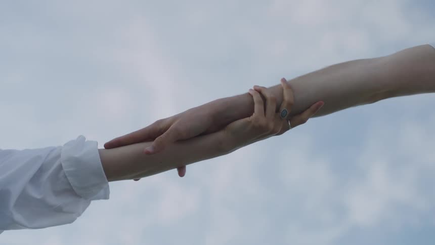 Man and woman arms and hands touching each other