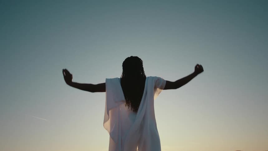 A woman practices martial arts outdoors